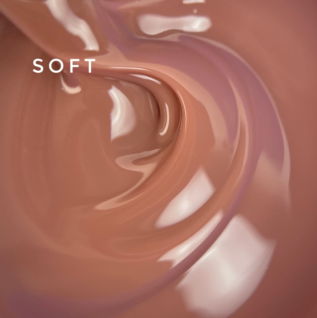 Melted chocolate with a swirling pattern and the word 'SOFT' above it.
