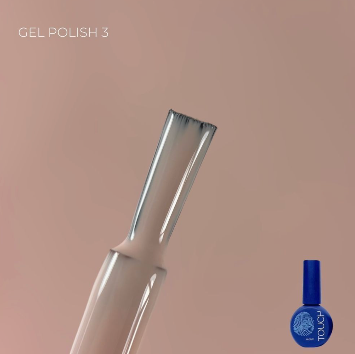 Nail art brush and blue nail polish bottle on a beige background