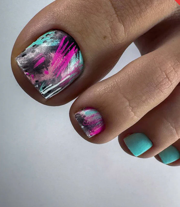 Nail art with pink and black abstract design on a light gray background