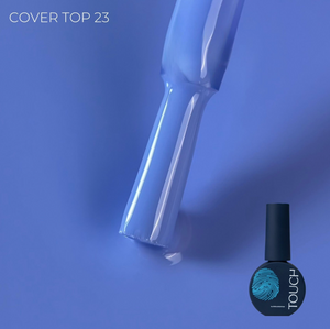 A bottle of nail polish with a brush applicator on a blue background, with the text 'COVER TOP 23' and 'TOUCH' visible on the bottle label.