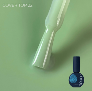 A bottle of nail polish with a brush applicator showing a glossy pale mint green color, labeled 'COVER TOP 22' on a matching mint green background. The bottle has a dark navy cap and base with a blue fingerprint logo and the brand name 'TOUCH'.