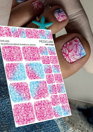 Nail wrap sheet with pink and blue designs held by a person with colorful nails.