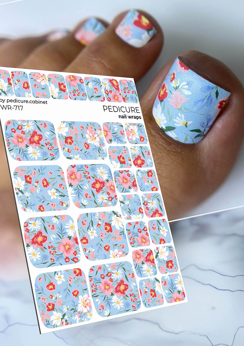 Floral nail wrap sheet with matching nail designs on a white background