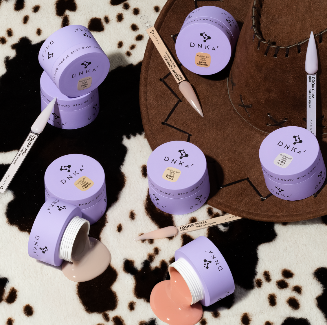 DNKa’ Builder Gel Light #0004 Desert 30ml – purple jars on cowhide background, stylish nail gel packaging