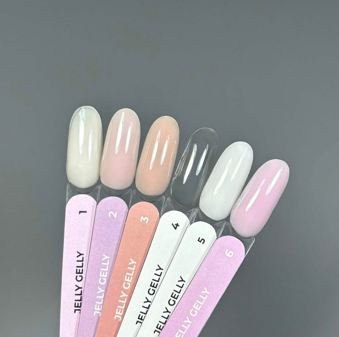 Set of Jelly Gelly nail polish samples on a gray background