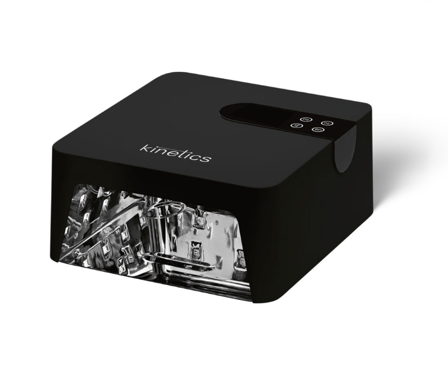 A black Kinetics UV lamp with a transparent acrylic front showing the internal light tubes, photographed on a clean white background.