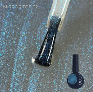 A bottle of TOUCH Mirror Top 02 nail polish with a brush showing the glittery blue-black polish, set against a sparkly silver-blue background with the product bottle shown in the lower right.
