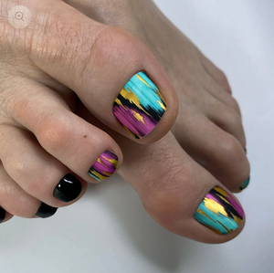 Colorful nail art on toes with a white background