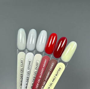 Set of gel nail polish samples with labels on a gray background