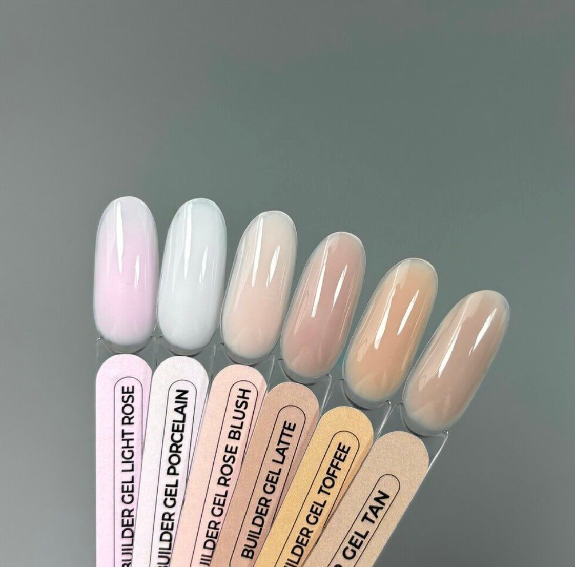 TOUCH Builder Gel Yogurt swatches in pink, nude, and brown tones arranged on gray background