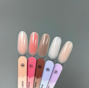 Set of gradient nail polishes on a gray background