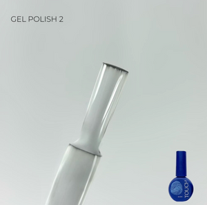 Nail polish bottle with blue polish and white applicator on a light gray background