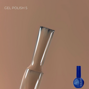 Gel polish bottle with a brush applicator on a brown background