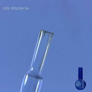 Clear nail polish bottle with blue cap on a blue background
