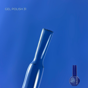 Blue gel polish bottle with 'TOUCA' branding on a blue background