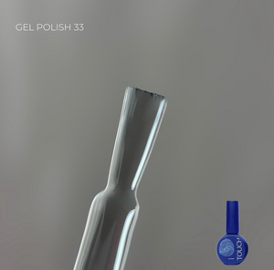 Gel polish bottle with a blue cap on a gray background