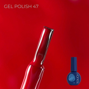 Red gel polish with a blue bottle labeled 'TOUCH' on a red background