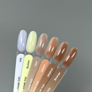 Set of nail polish samples with labels on a gray background